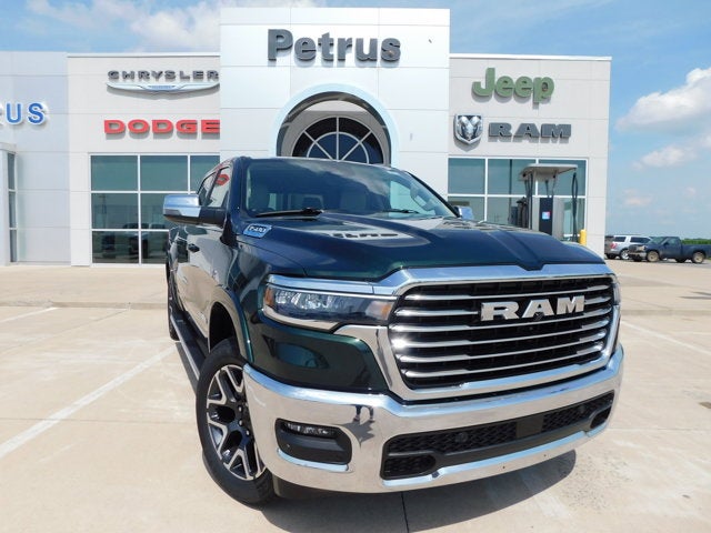 2026 RAM Ram 1500 RAM 1500 LARAMIE CREW CAB 4X4 5'7' BOX in Serrano-Green Metallic Exterior Paint — front three-quarter view