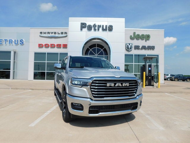 2026 RAM Ram 1500 RAM 1500 LARAMIE CREW CAB 4X4 5'7' BOX in Silver Zynith Exterior Paint — front three-quarter view