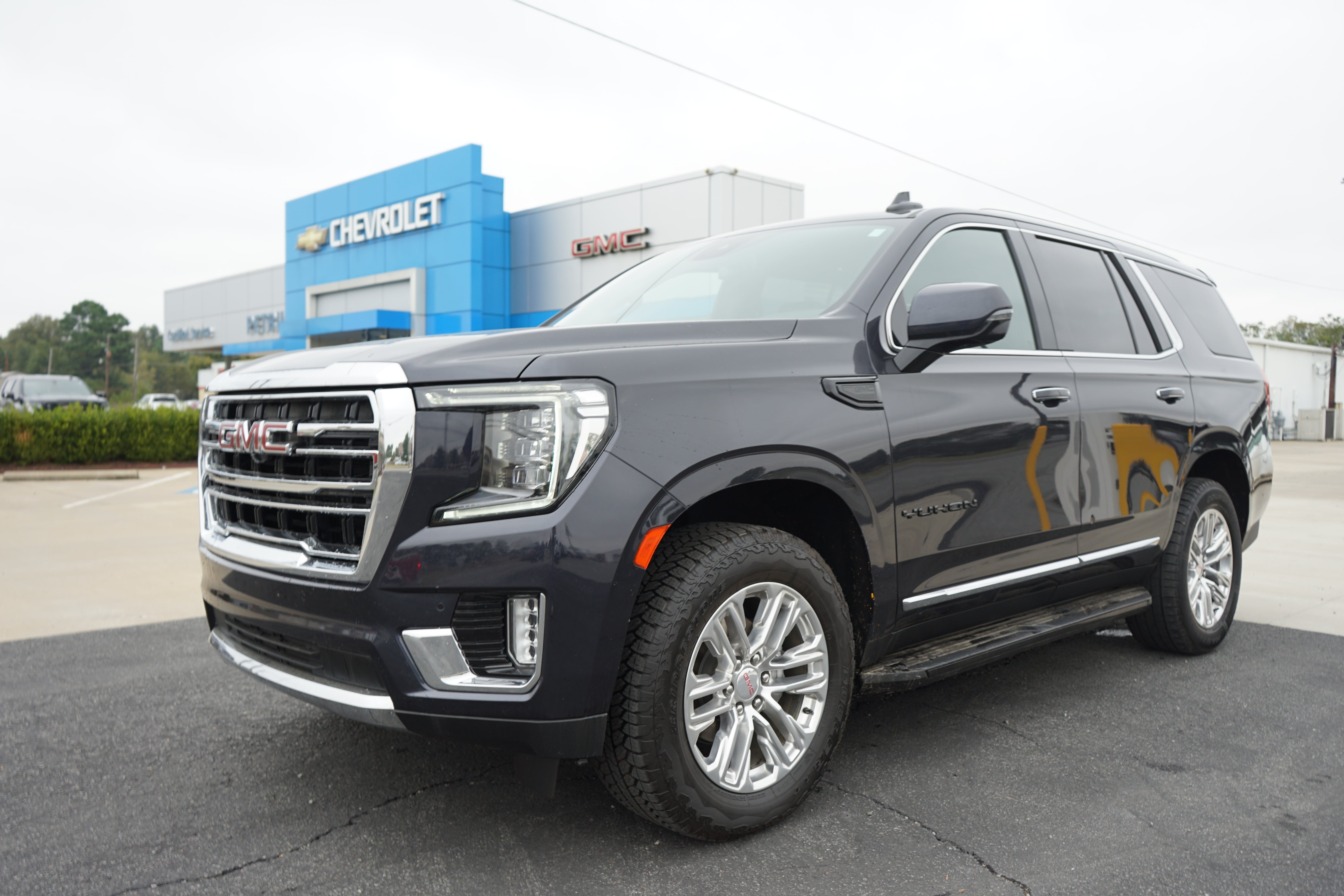 2023 GMC Yukon SLT in Titanium Rush Metallic — front three-quarter view
