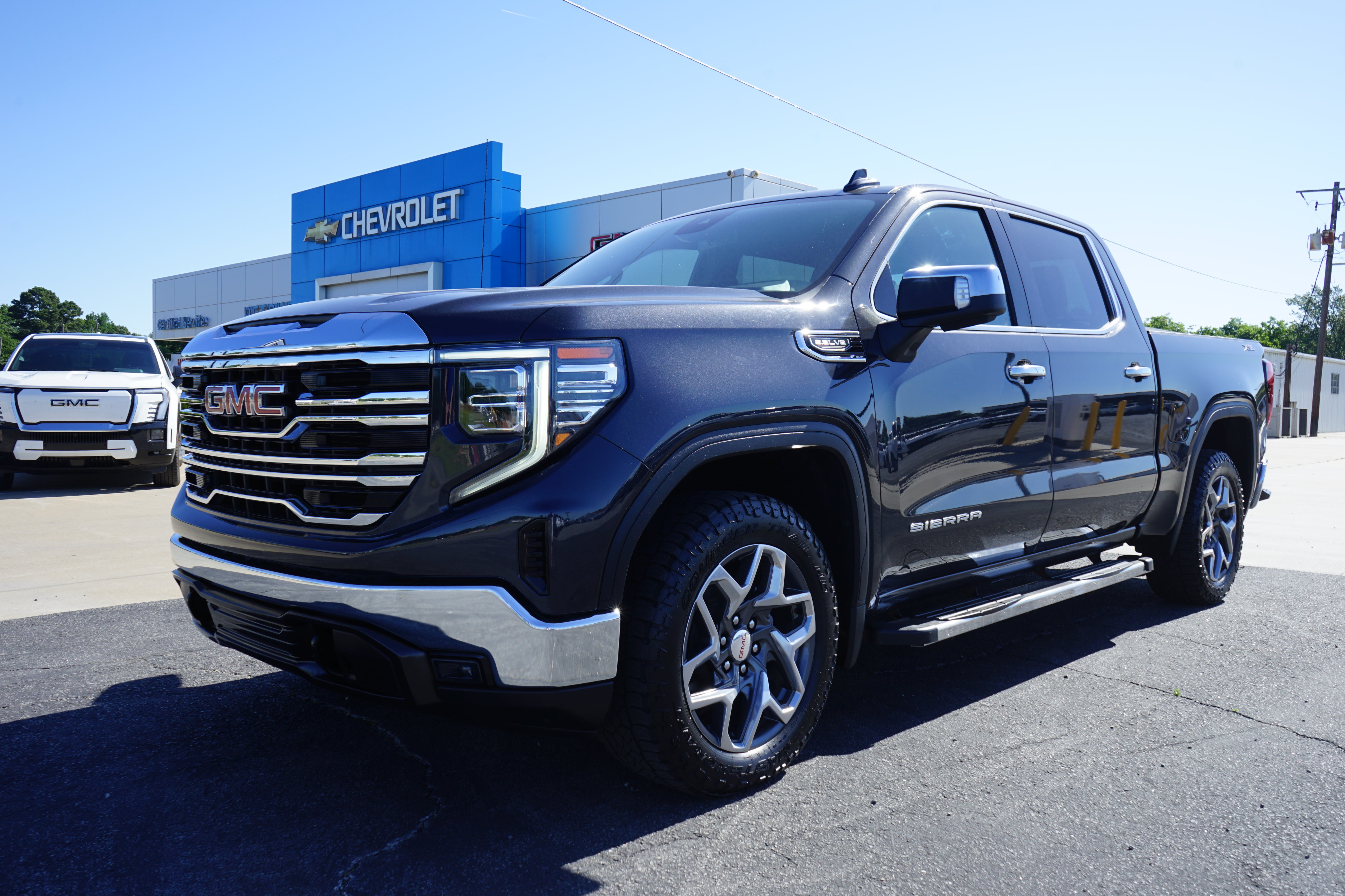 2024 GMC Sierra 1500 SLT in Titanium Rush Metallic — front three-quarter view