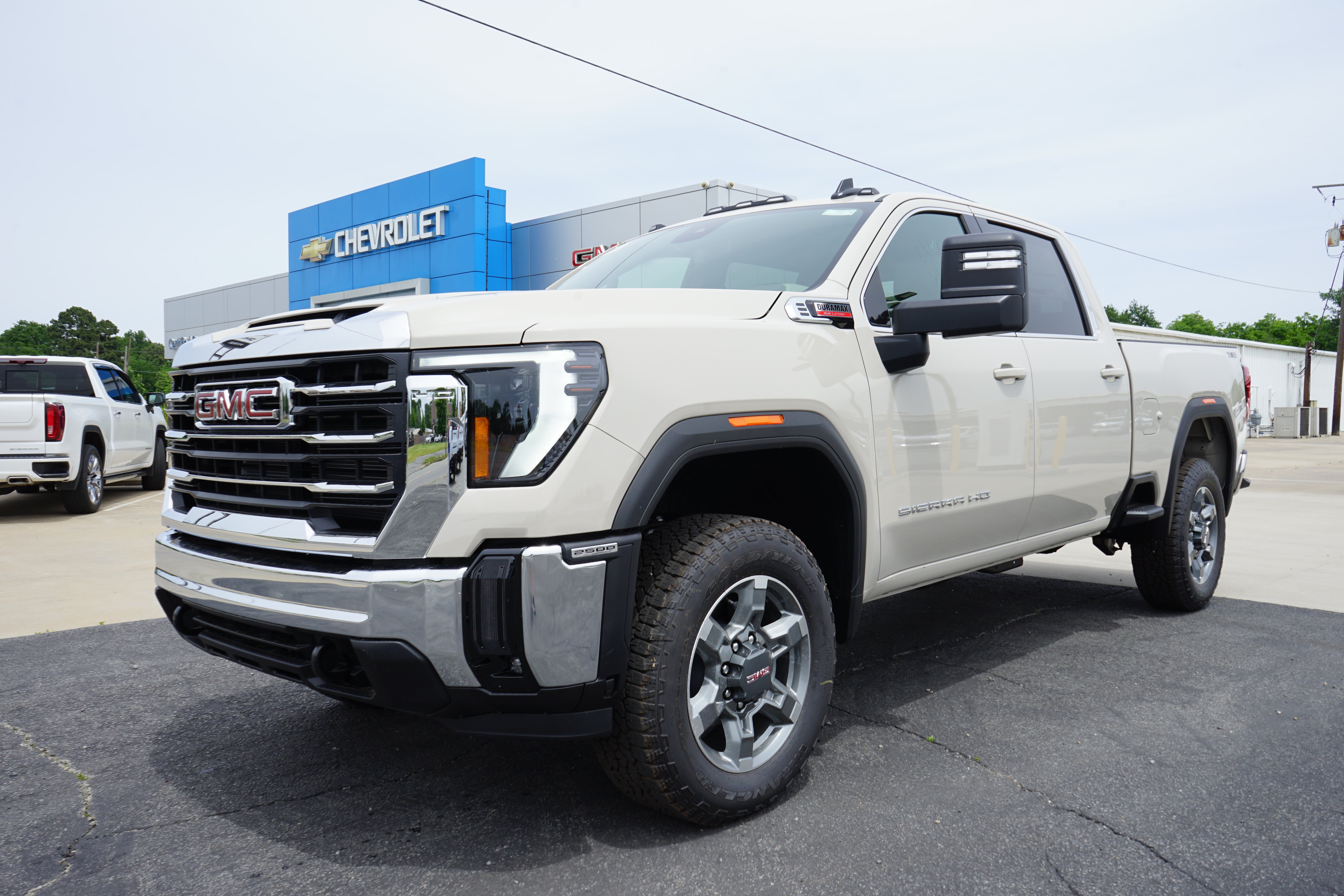 2026 GMC Sierra 2500 HD SLE in Coastal Dune — front three-quarter view